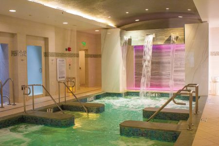 indoor spa at boca west with water fall wall and jacuzzi